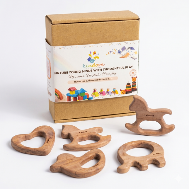 Set of wooden teething rings with a Kindora branded box on a white background